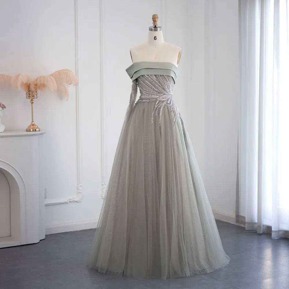 Abito da ballo a linea A con scollatura asimmetrica, maniche lunghe e decorato con paillettes