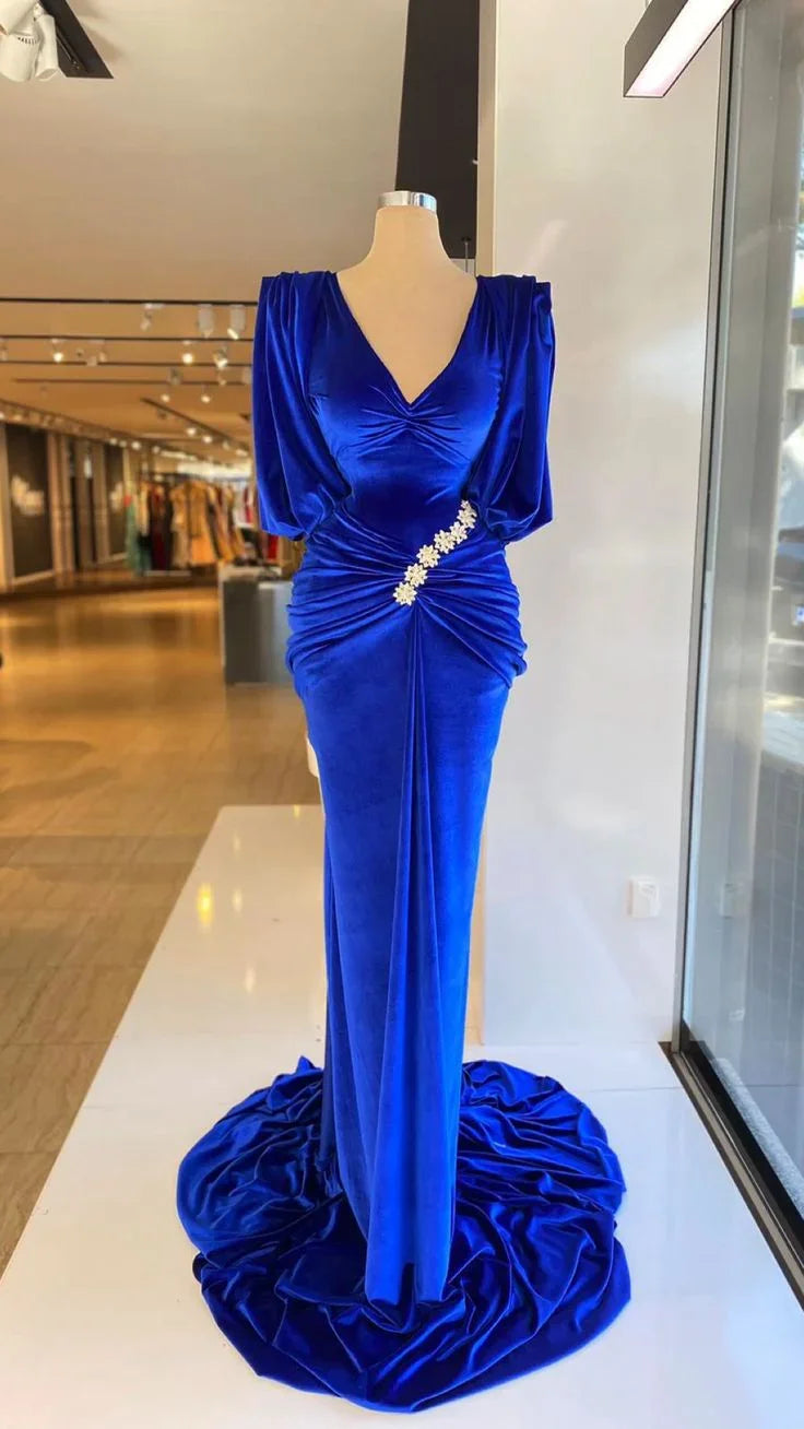 Elegant royal blue velvet evening gown with floral embellishment displayed on mannequin at ZAPDRESS