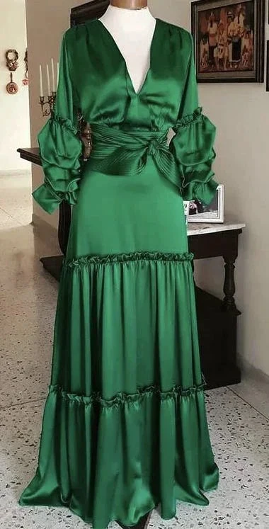 Elegant long green satin dress with ruffled sleeves on display in a stylish room, ZAPDRESS