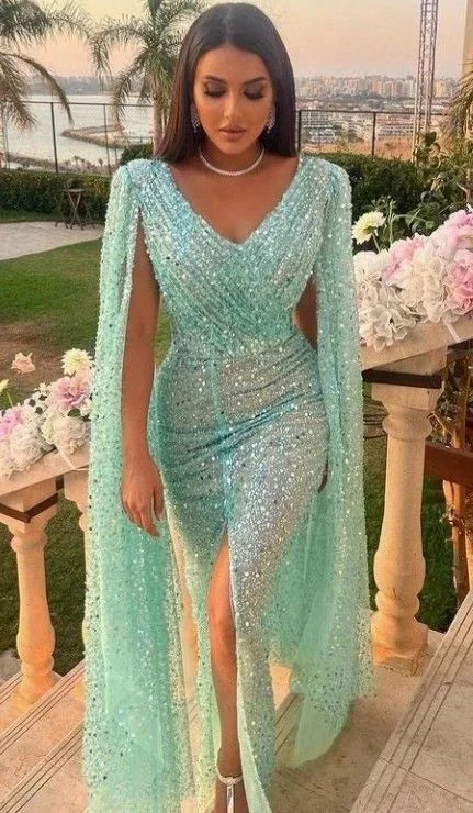 Woman in sparkling turquoise sequin evening gown with cape, outdoor event, ZAPDRESS fashion