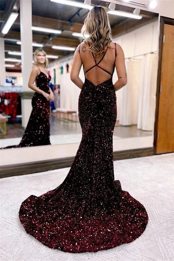 Woman in a sparkly backless burgundy evening dress inside a boutique, ZAPDRESS fashion