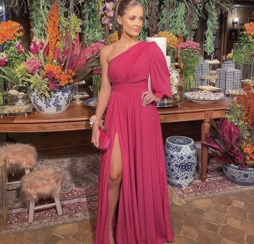Woman in elegant one-shoulder magenta dress at floral event, ZAPDRESS fashion