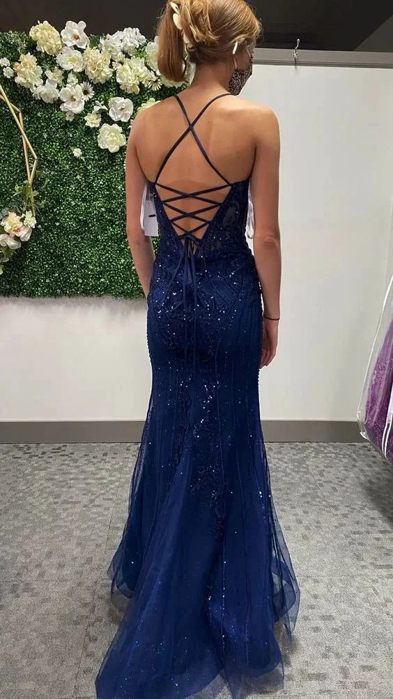 Woman in a navy blue sequin evening gown with lace-up back at ZAPDRESS boutique