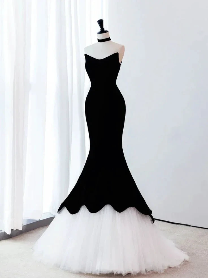 Elegant black and white mermaid gown on mannequin in bright room, ZAPDRESS fashion