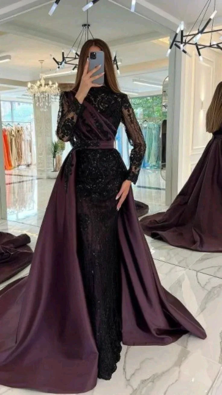 Woman in a black and purple formal evening gown with lace sleeves at ZAPDRESS boutique