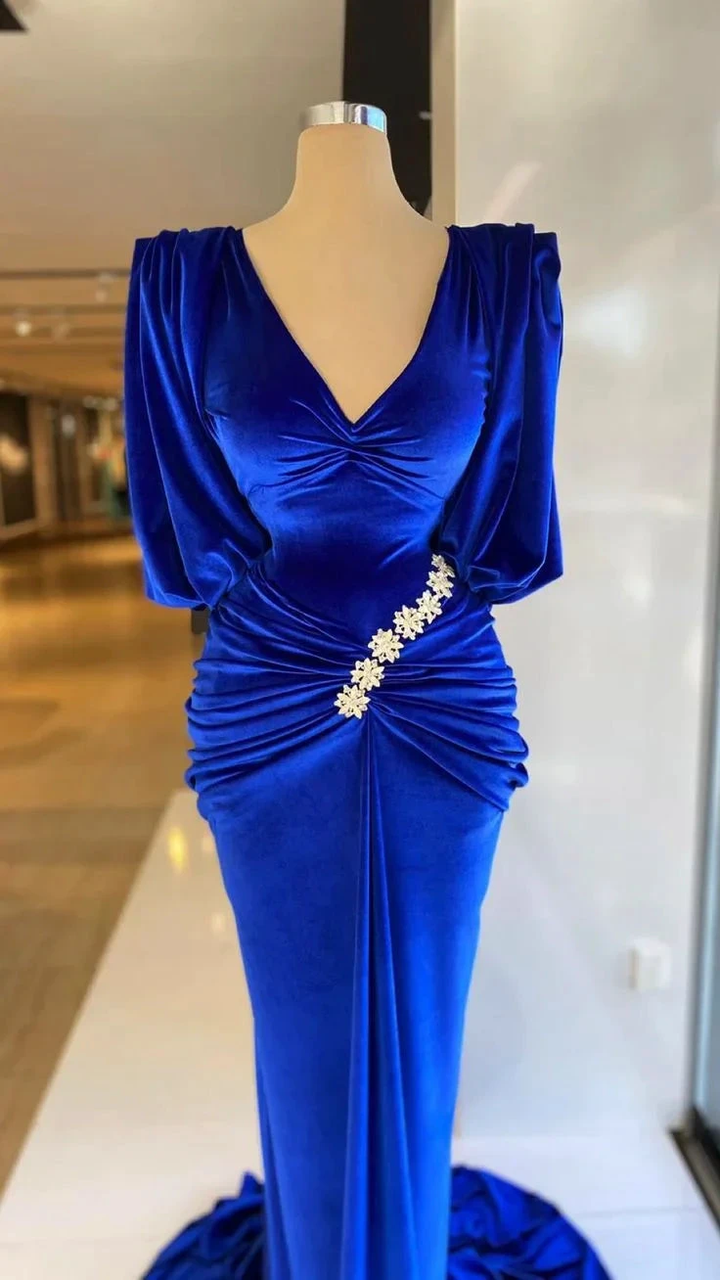 Royal blue velvet evening gown with floral embellishment on waist, displayed on mannequin at ZAPDRESS.