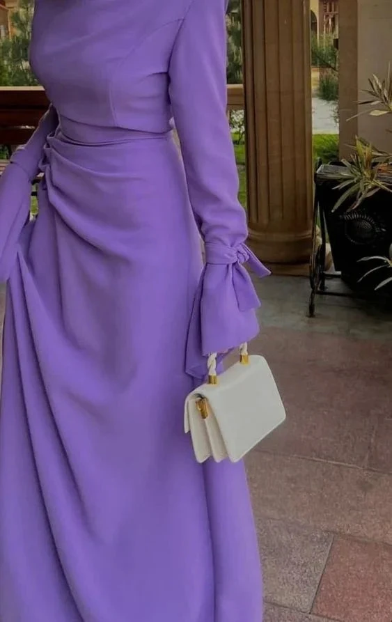 Woman in elegant lavender dress with bow sleeves holding white handbag, ZAPDRESS fashion