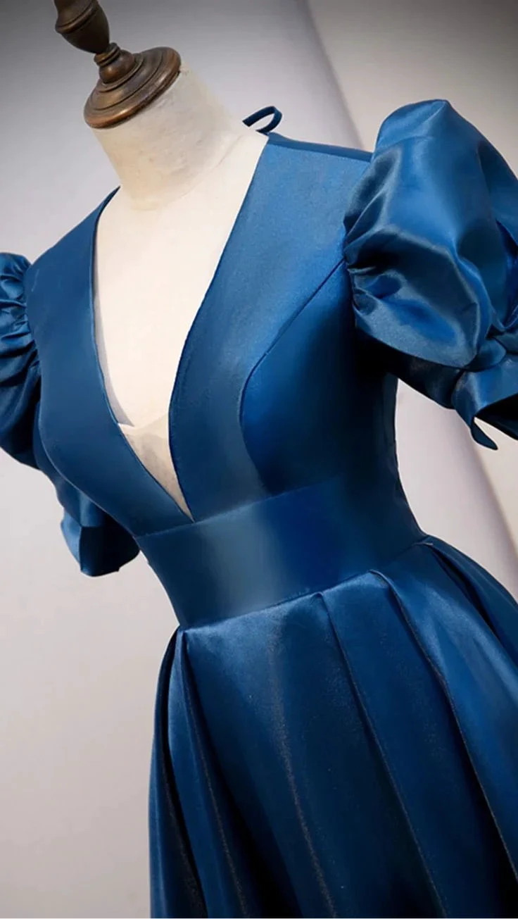 Elegant blue satin dress with puff sleeves and deep V-neck on mannequin, ZAPDRESS fashion