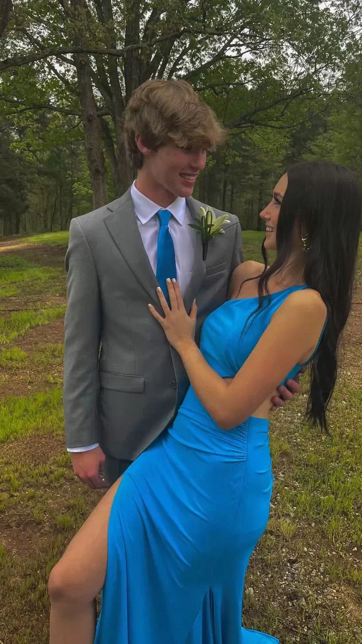 Couple outdoors in formalwear, woman in blue dress from ZAPDRESS, man in grey suit