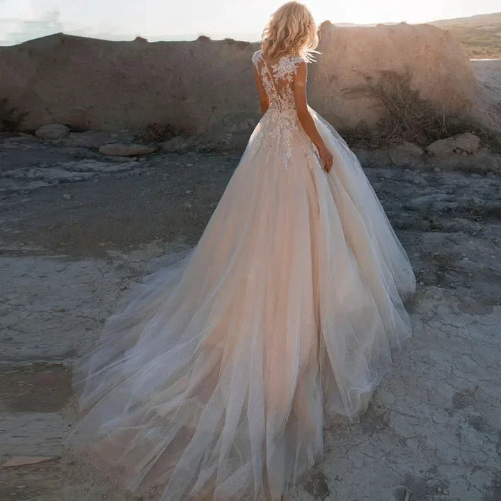 Gorgeous White Tulle O-Neck Sleeveless Decal Luxury Pearl Embroidery Button A-line Floor-Length Bridal Ball Dress by payinti