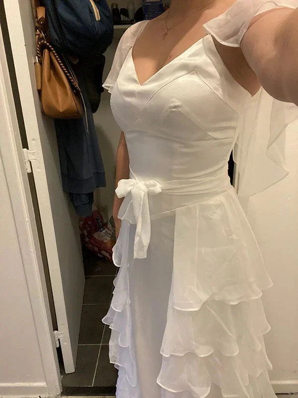Woman wearing elegant white ruffle dress with V-neck and tie waist, ZAPDRESS fashion