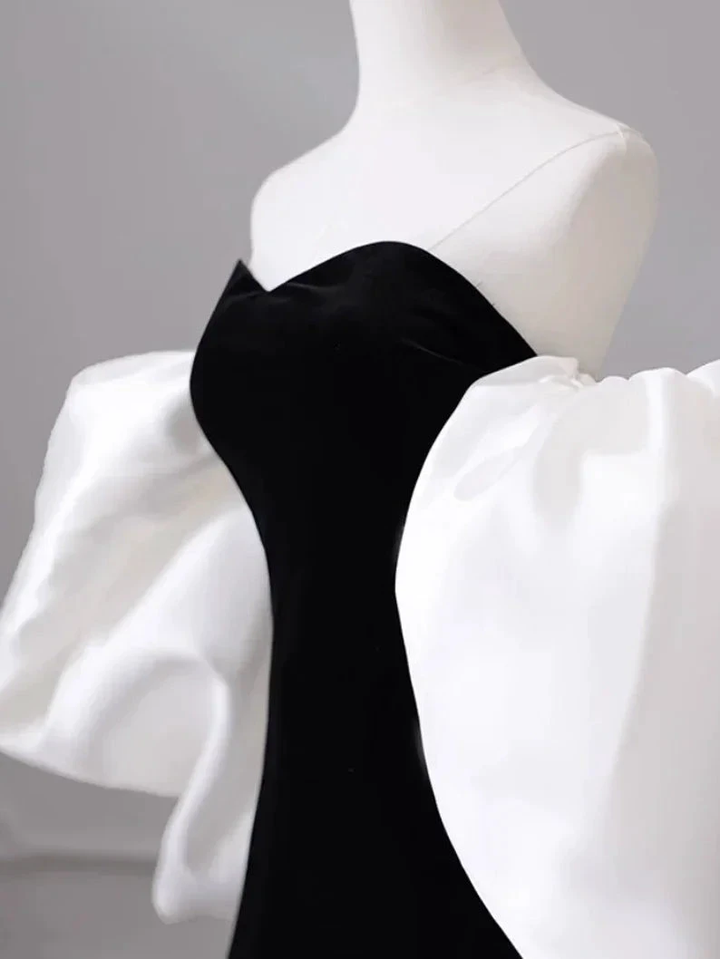 Elegant black dress with dramatic white puff sleeves on mannequin, ZAPDRESS fashion