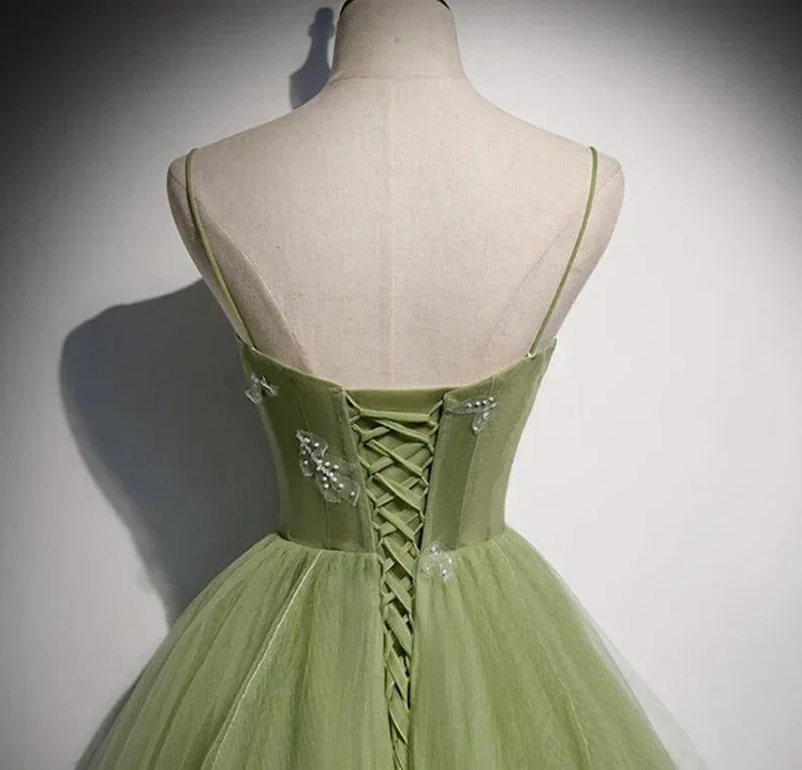 Elegant green tulle dress with lace-up back and sequin details on mannequin, ZAPDRESS