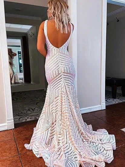 Woman in shimmering sequin mermaid gown with low back, in elegant hallway, ZAPDRESS fashion