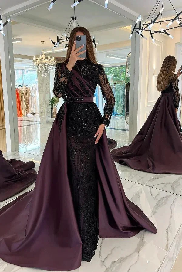 Woman in a black and purple evening gown with lace sleeves at ZAPDRESS boutique