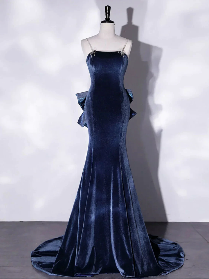 Elegant navy blue velvet evening gown with straps and ruffled sides on mannequin at ZAPDRESS