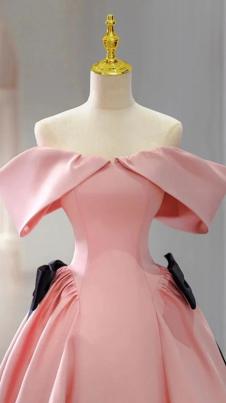 Elegant pink off-shoulder gown on mannequin with gold stand, featured on ZAPDRESS homepage