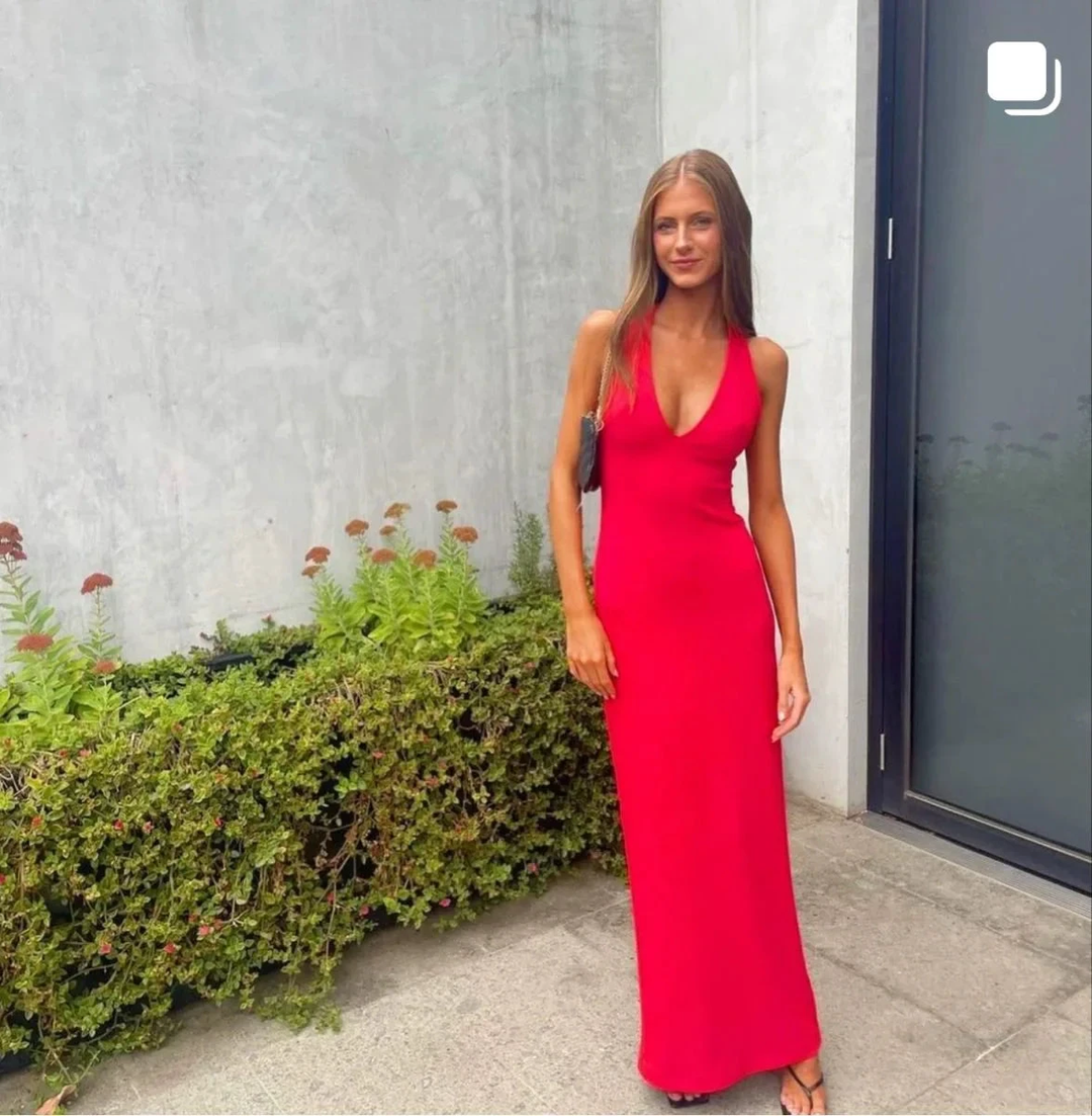 Woman in red sleeveless dress posing outdoors beside greenery, ZAPDRESS fashion style