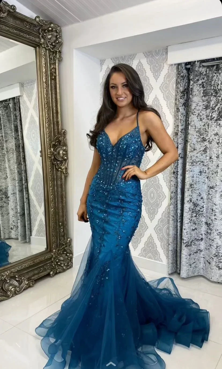 Woman in blue sequin mermaid dress posing indoors next to ornate mirror, ZAPDRESS fashion