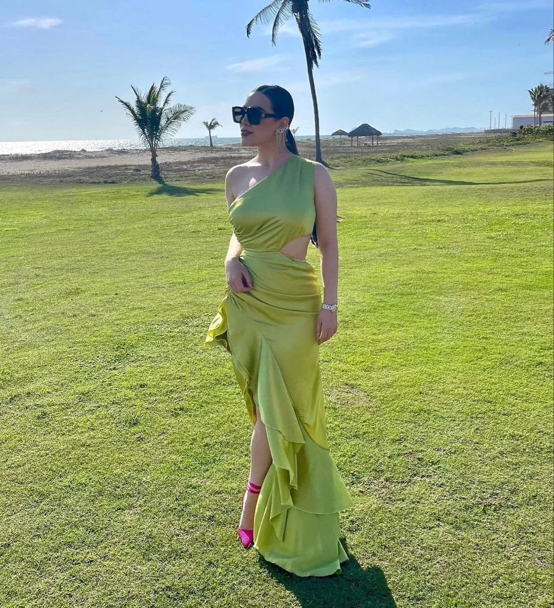 Woman in lime green one-shoulder gown with ruffles, sunglasses, outdoors near beach, ZAPDRESS