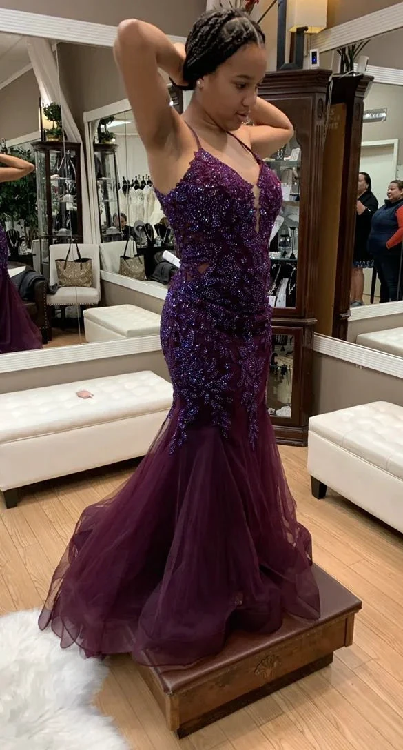 Woman in boutique wearing purple sequin mermaid gown, fitting for ZAPDRESS formal dress shop