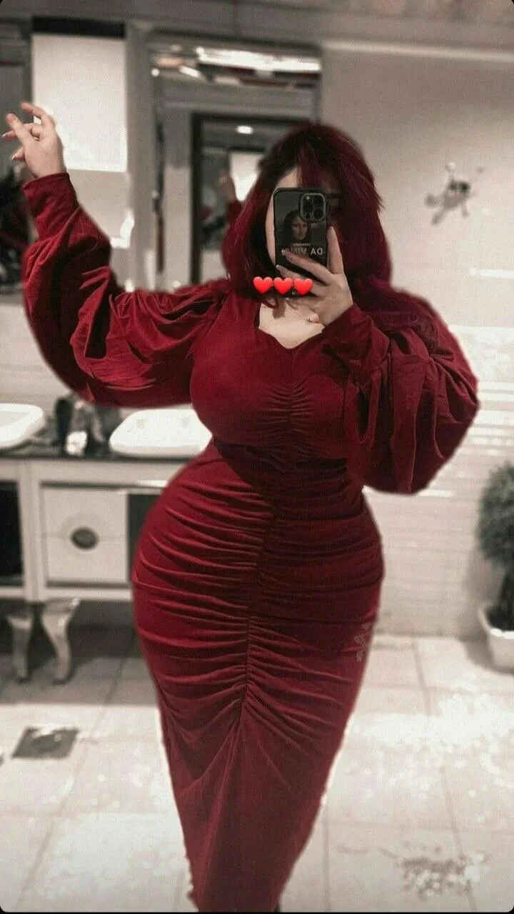 Woman in red velvet ruched dress taking mirror selfie in elegant bathroom, ZAPDRESS fashion