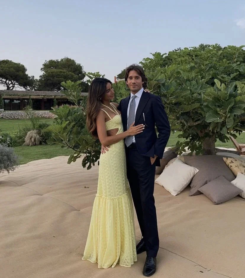 Woman in yellow dress and man in suit posing outdoors with greenery, ZAPDRESS fashion