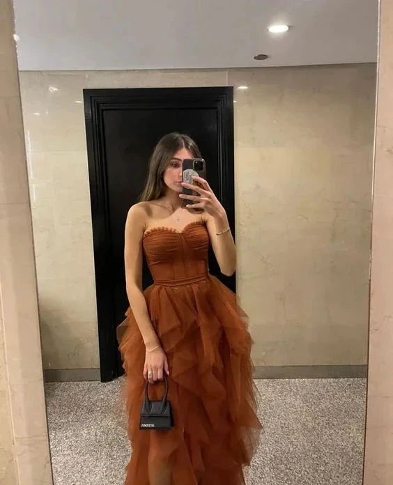 Woman in a strapless brown ruffle dress taking a mirror selfie, ZAPDRESS fashion