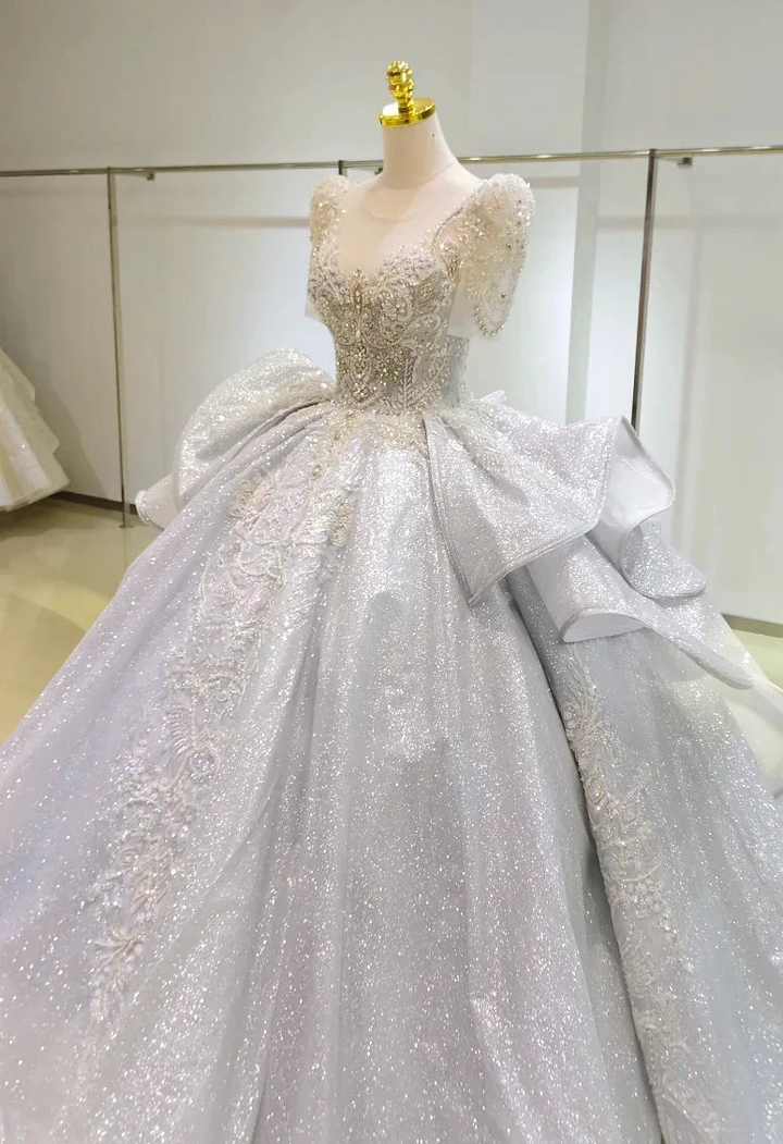 Silver Glimmer V-Neck Ballgown: Crystal-Embroidered Bust &amp; Dramatic Bow Train by ZAPDRESS