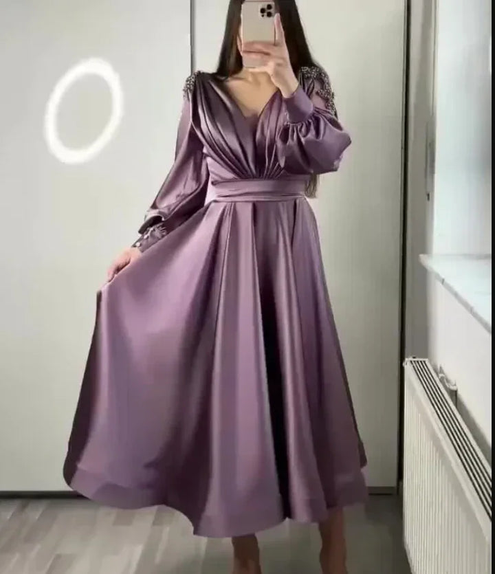 Woman wearing a satin purple long sleeve midi dress from ZAPDRESS mirror selfie