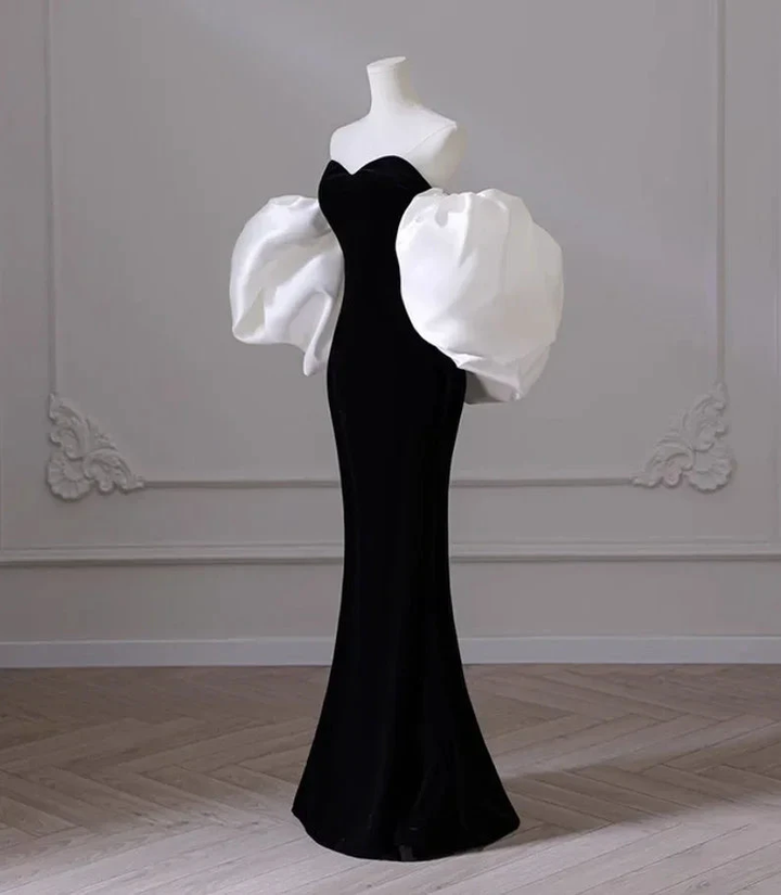 Elegant black evening gown with dramatic white puff sleeves on mannequin, ZAPDRESS fashion