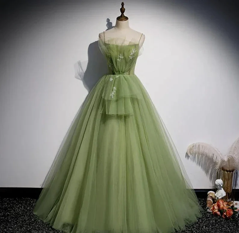 Light green tulle evening gown on mannequin with floral embroidery, ZAPDRESS fashion boutique