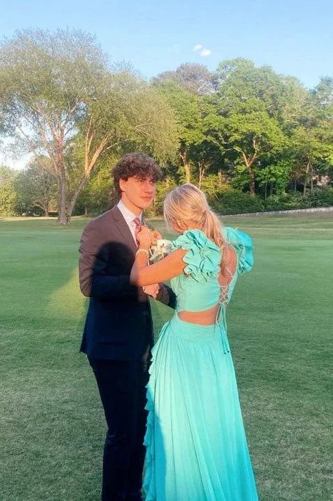 Couple in formal attire, girl in aqua dress, standing on green lawn with trees, ZAPDRESS
