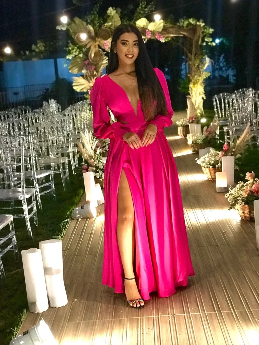Woman in vibrant pink evening dress at elegant outdoor event, floral arch and clear chairs