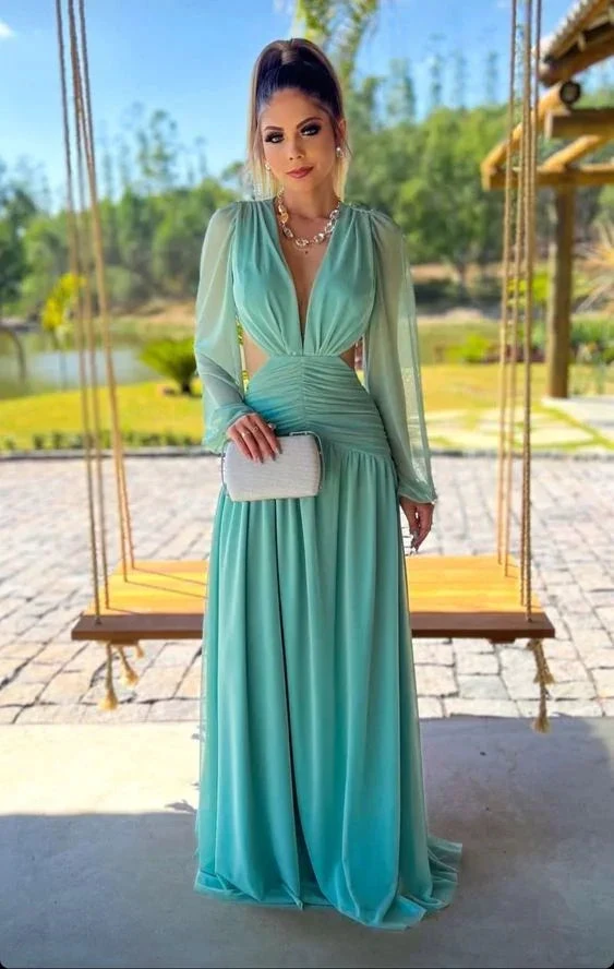 Woman in elegant mint green evening gown holding white clutch in garden, ZAPDRESS fashion