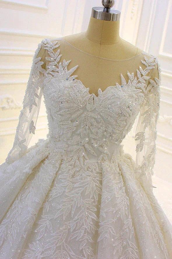 Robe de mariée longue de luxe en tulle avec applications en dentelle et manches